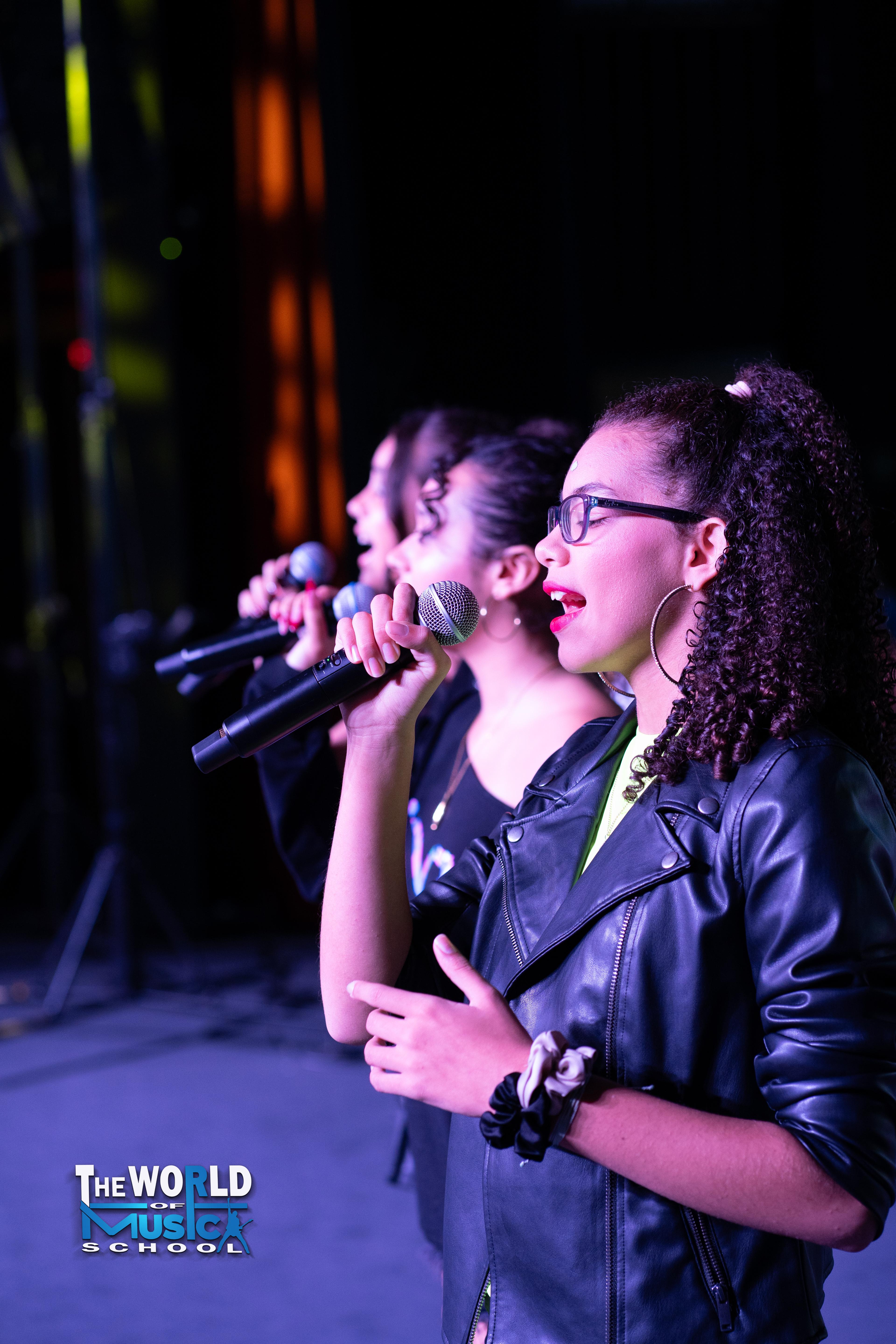 Vocalists performing on stage