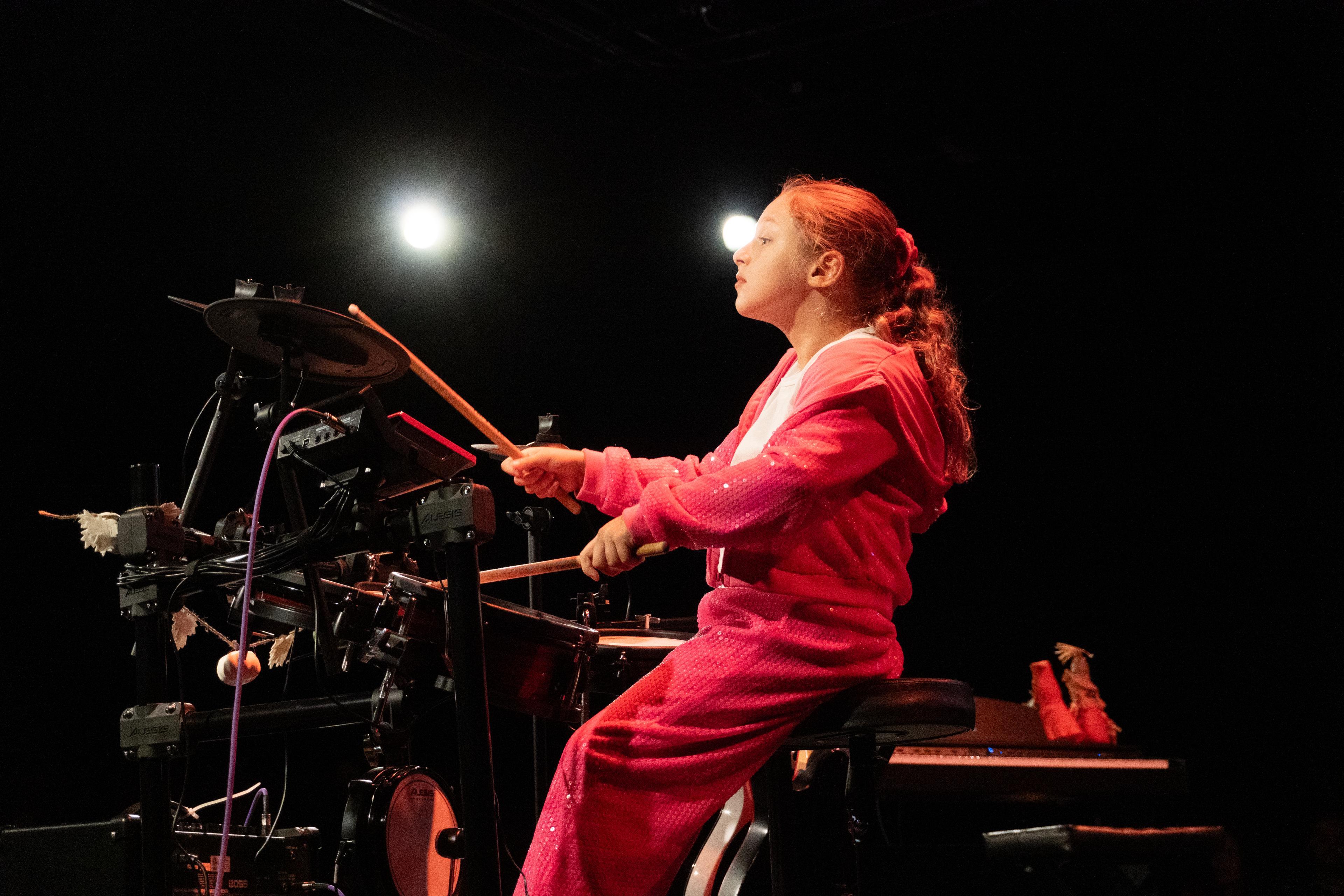 Young drummer performing