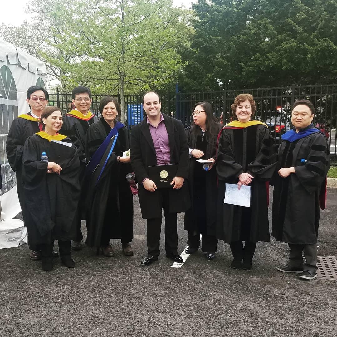 Max Acosta graduation day at Kean University with faculty